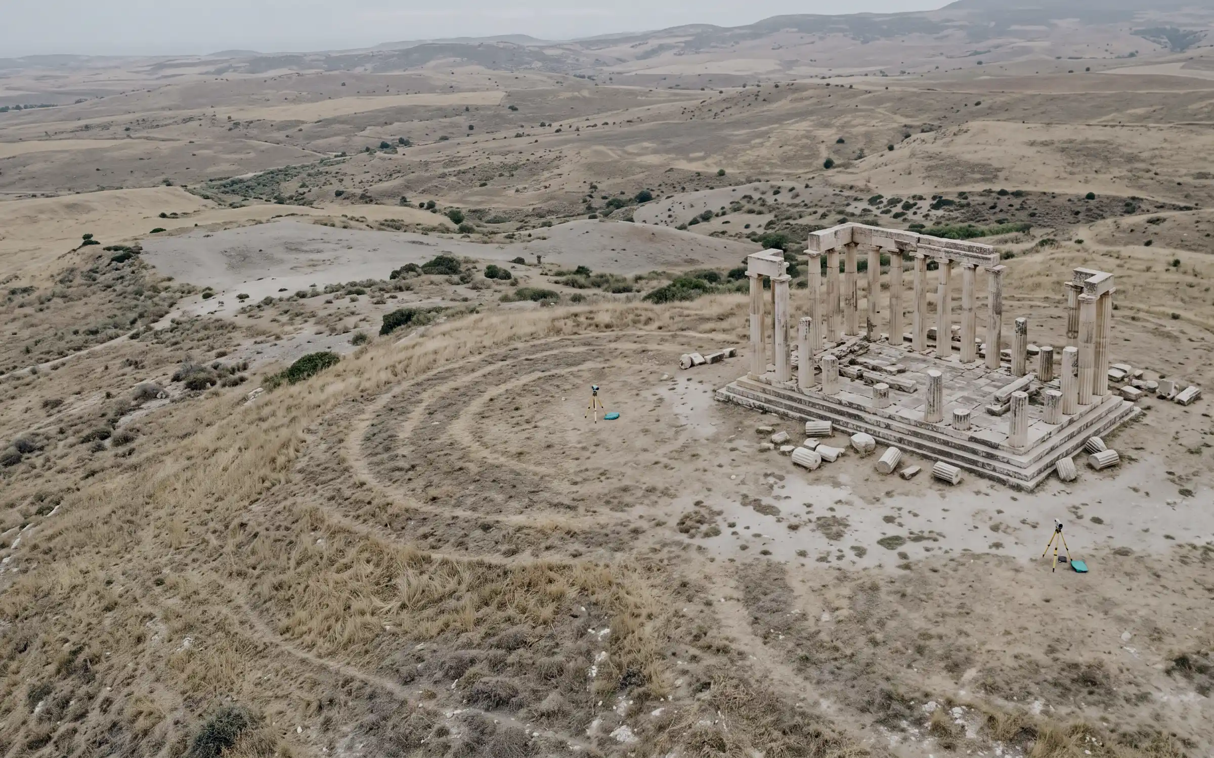 AI-generated scene: the ruins of a small temple on a low hill, seen from the air.